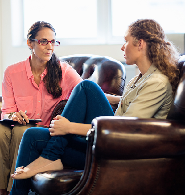 Woman being counseled to determine if she's a candidate for Dual Diagnosis Treatment